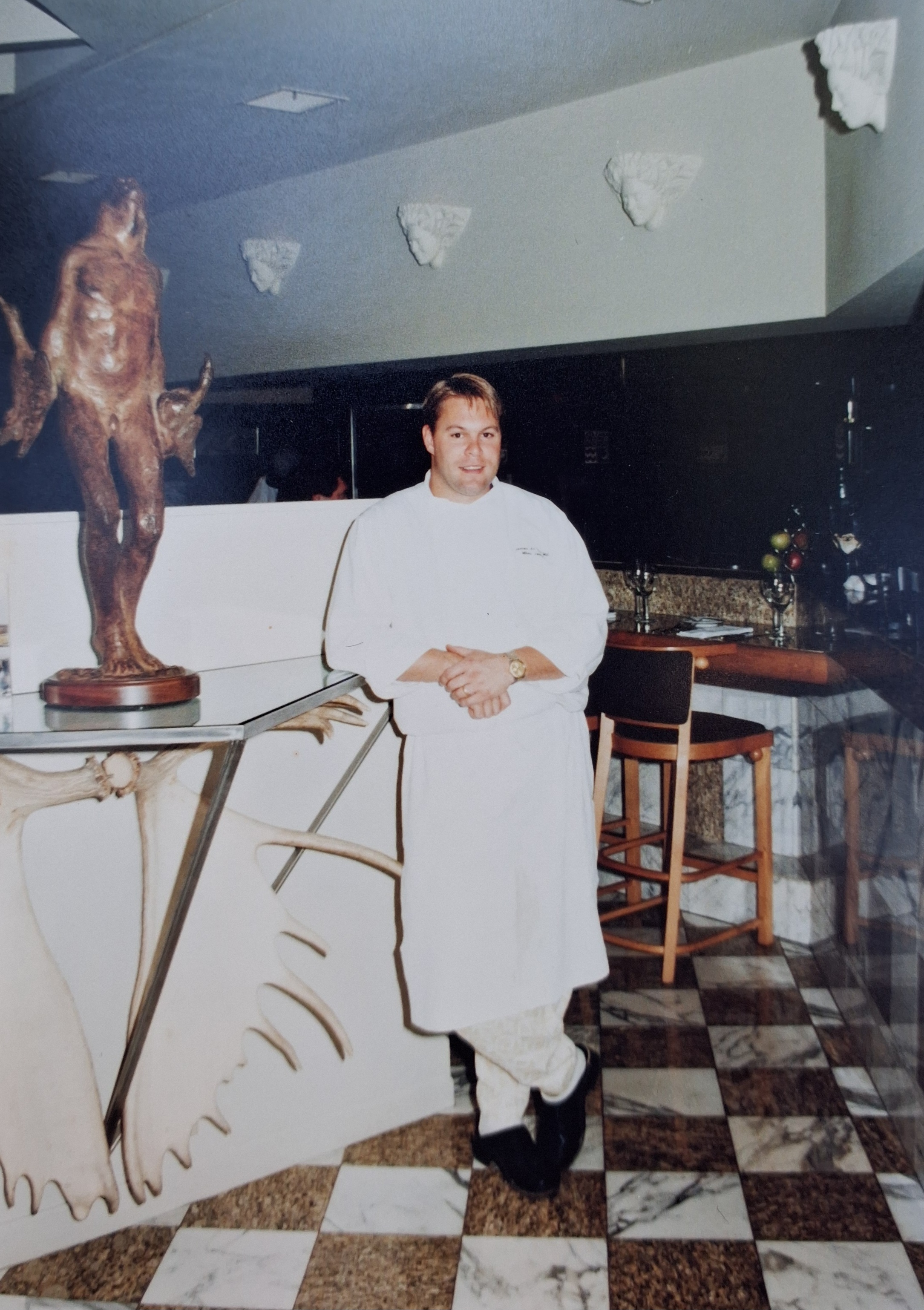 Chef Miles James standing at the entrance to the dining area.