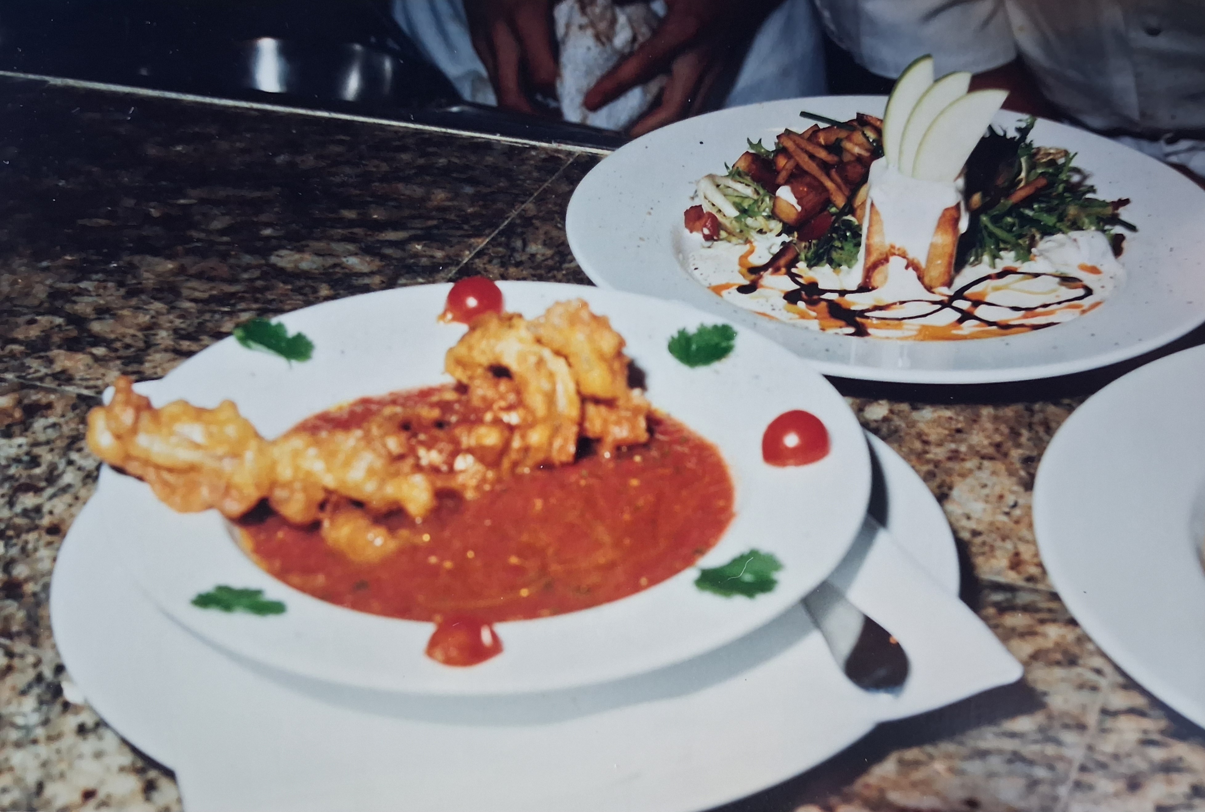 Fried blue crab with gazpacho beside potato salad with frissé and goat cheese.