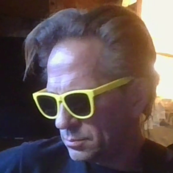 Portrait of a person wearing yellow sunglasses